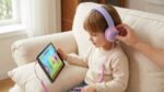 Child wearing Adoope Kids Headphones with volume limiter set
