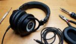Audio-Technica ATH-M50x headphones with worn ear pads being replaced